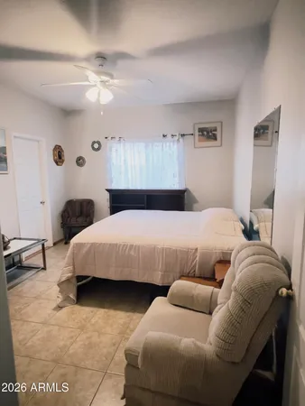 a living room with furniture and a chair
