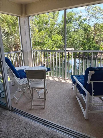 a view of a balcony with chairs