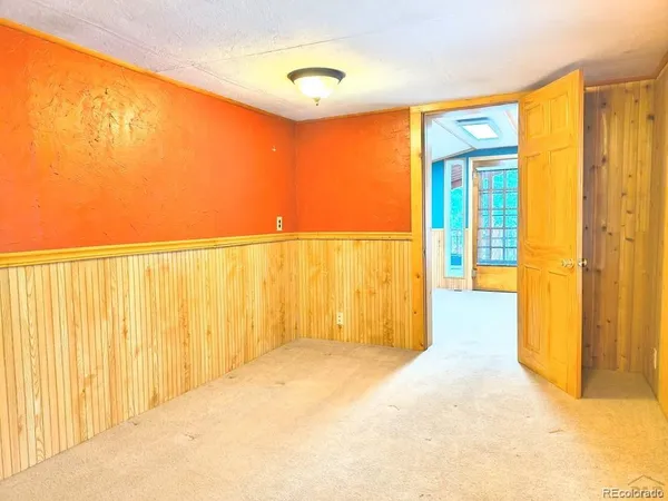 a white toilet sitting next to a bathroom sink and a shower