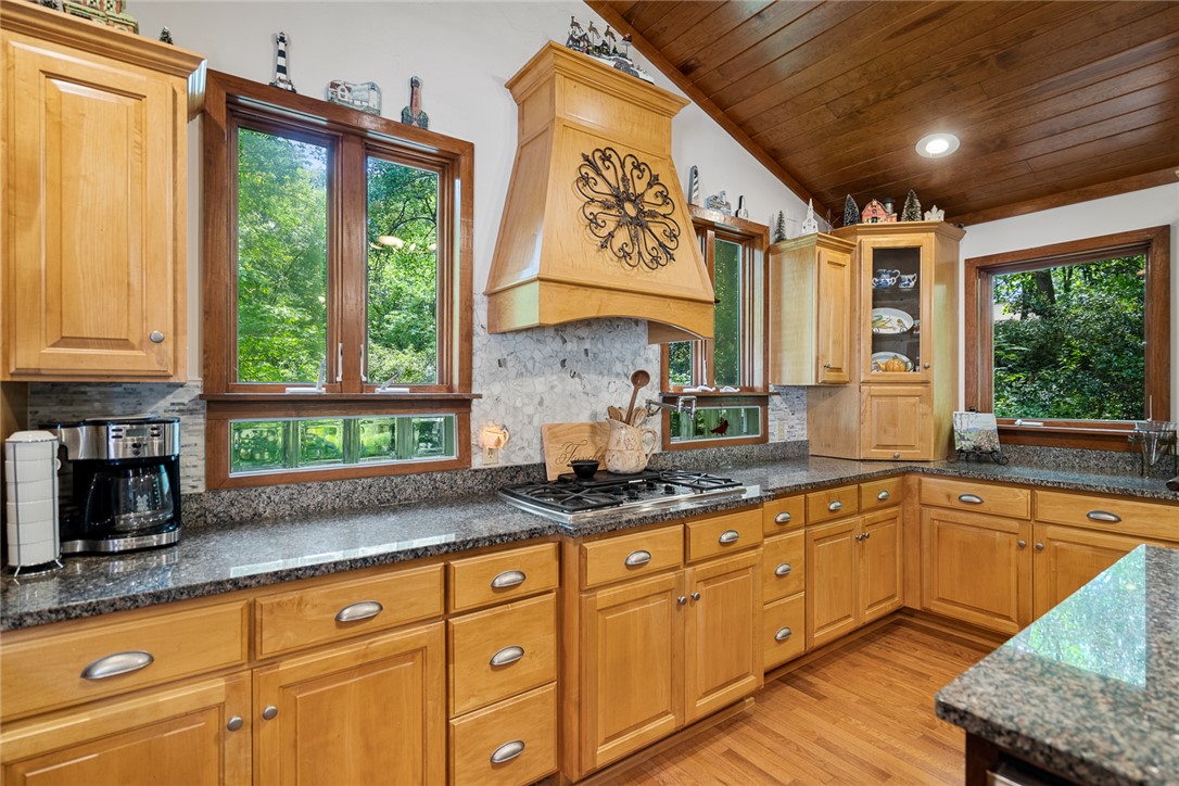 324 Hobson Road Anderson, SC 29621 - Photo 19 of 46 This spacious kitchen offers ample wood cabinetry and granite countertops, perfect for culinary endeavors.
