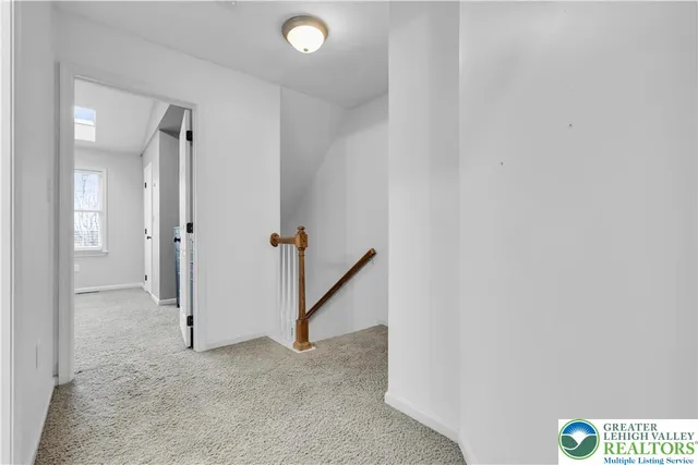 a view of an empty room and closet area