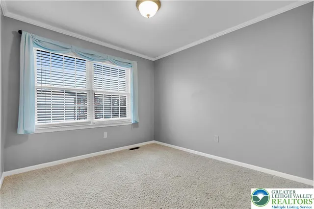 a view of a kitchen with a sink and a refrigerator