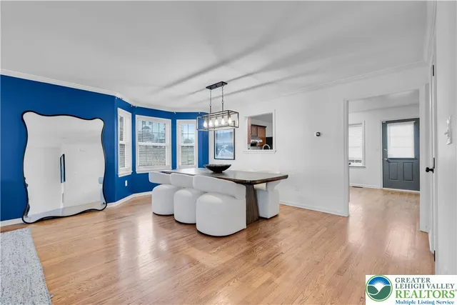 a kitchen with a refrigerator sink and cabinets