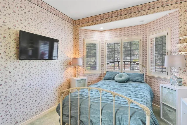 a view of a room with furniture and a window