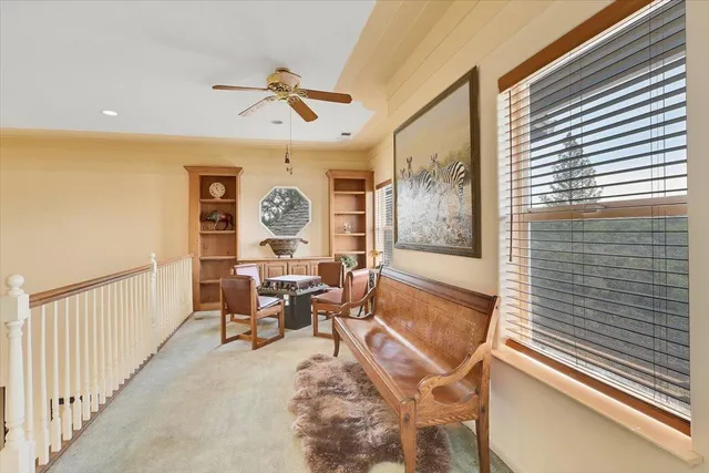 a bathroom with a toilet and a shower curtain