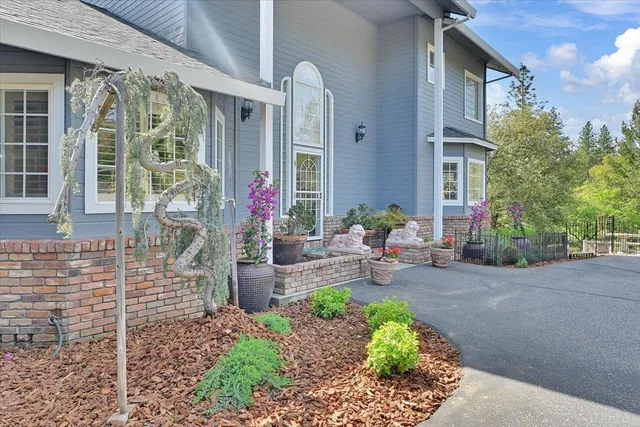 a front view of a house with outdoor seating