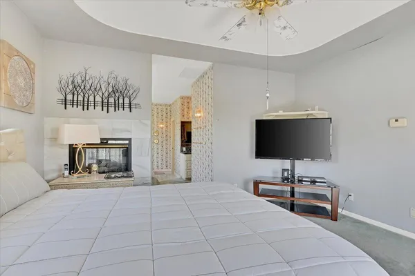 a living room with fireplace furniture and a wooden floor