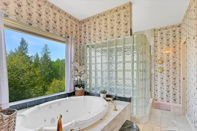 a kitchen with kitchen island granite countertop a sink and counter space