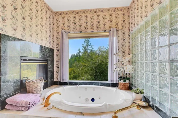 a room with lots of furniture and view of living room