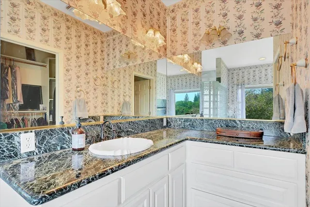 a view of a patio with table and chairs with wooden floor and floor to ceiling window