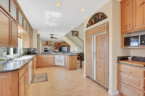 a view of a garden with wooden fence
