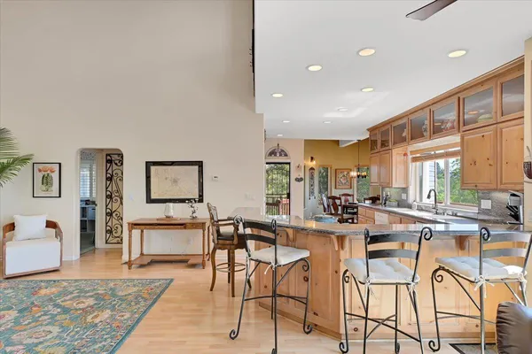 an aerial view of a house with a yard and lake view