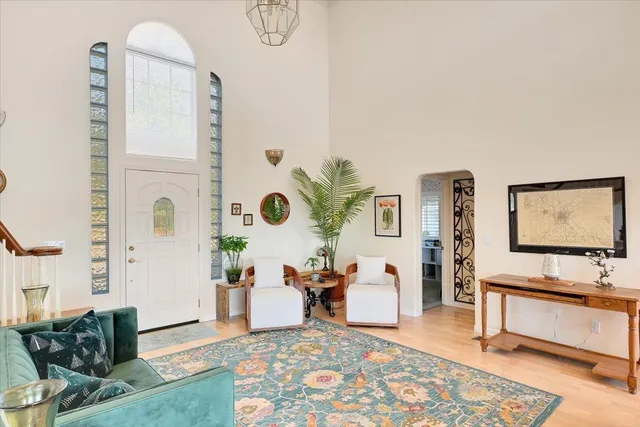 an aerial view of a house with a yard and lake view