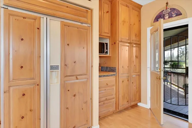 a view of a house with garden and sitting area