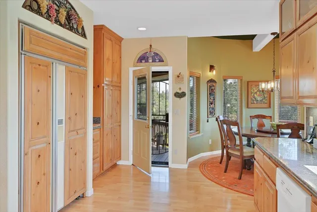 a aerial view of a house with swimming pool and sitting area