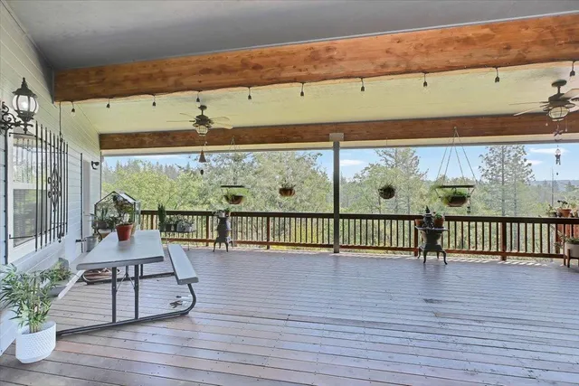 an aerial view of residential house with swimming pool and lawn chairs