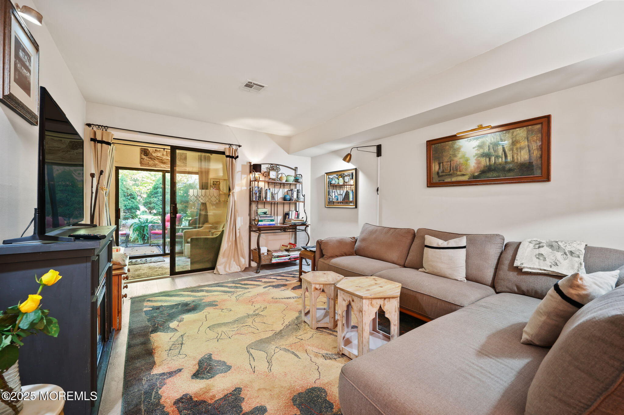 88 Friendship Court Red Bank, NJ 07701 - Photo 11 of 33 a living room with furniture and a flat screen tv