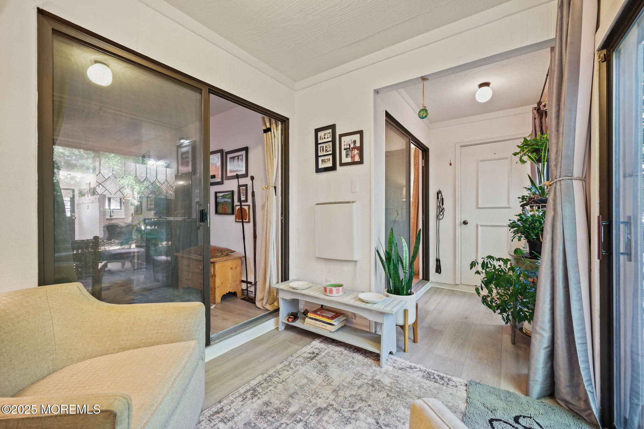 88 Friendship Court Red Bank, NJ 07701 - Photo 13 of 33 a living room with furniture and a potted plant
