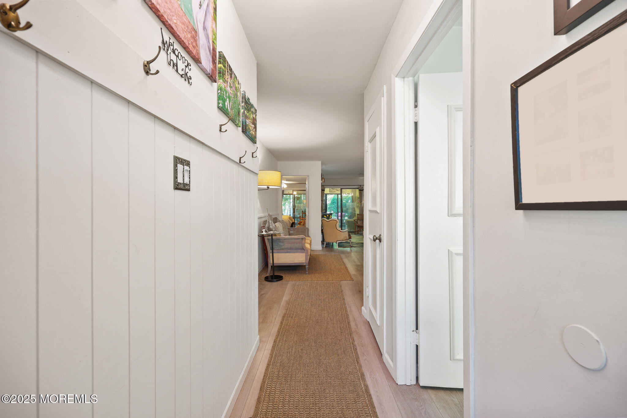 88 Friendship Court Red Bank, NJ 07701 - Photo 4 of 33 a view of a hallway with wooden floor and staircase