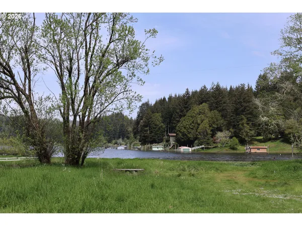 a view of outdoor space with green field and trees