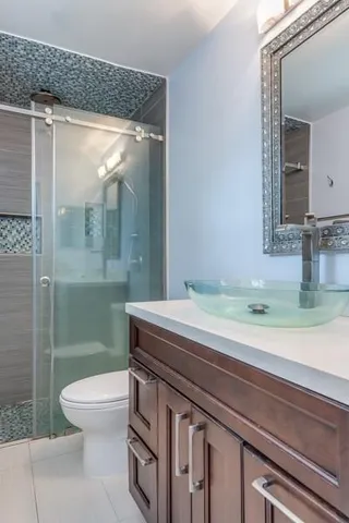 a bathroom with a shower and a sink