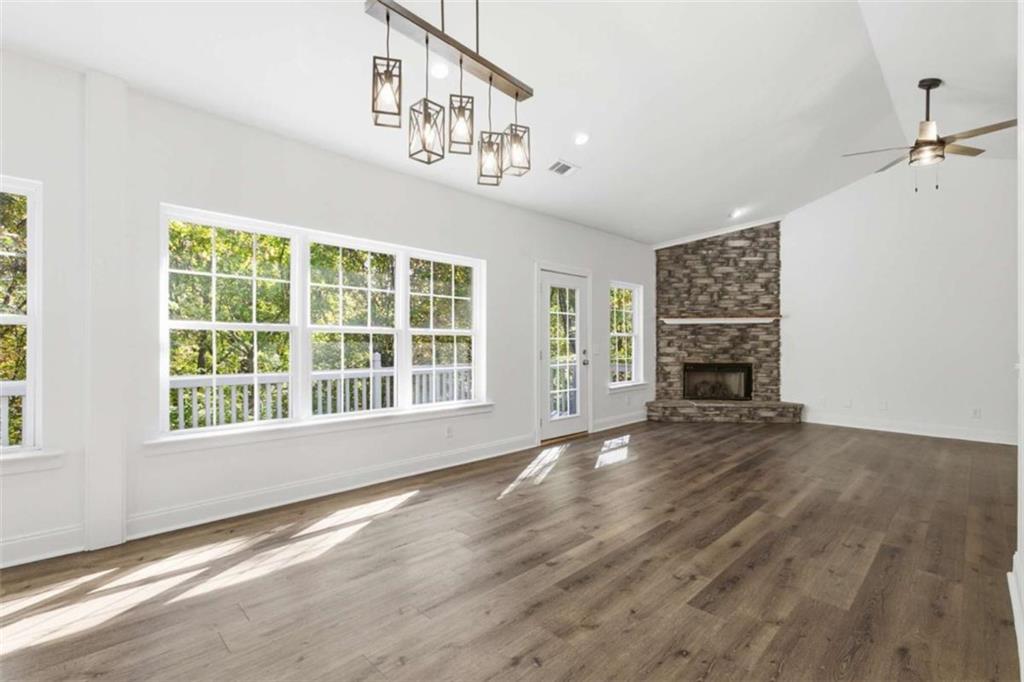622 Spring Crest Road Cleveland, GA 30528 - Photo 13 of 48 a view of an empty room with wooden floor and a window