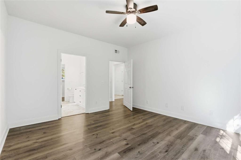 622 Spring Crest Road Cleveland, GA 30528 - Photo 20 of 48 an empty room with wooden floor and windows