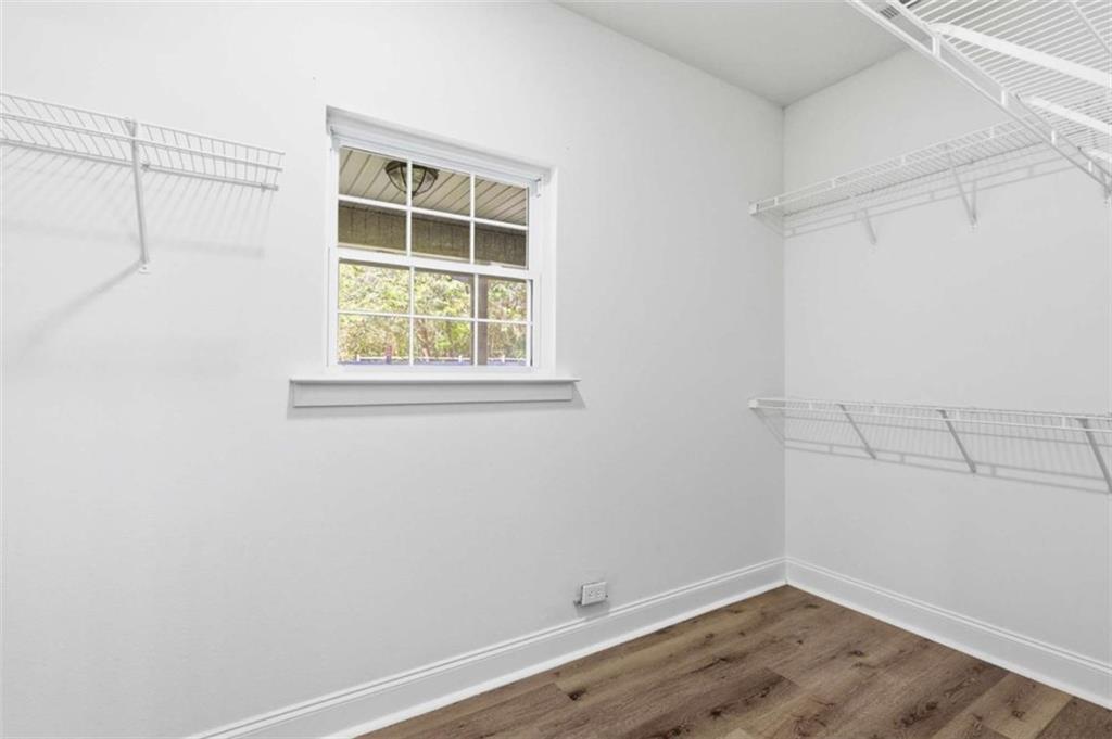 622 Spring Crest Road Cleveland, GA 30528 - Photo 24 of 48 an empty room with wooden floor and windows