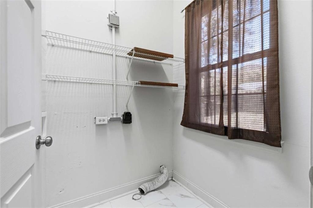 622 Spring Crest Road Cleveland, GA 30528 - Photo 25 of 48 a bathroom with a window and a shower
