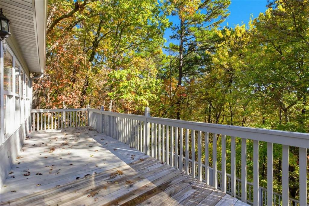 622 Spring Crest Road Cleveland, GA 30528 - Photo 27 of 48 a balcony with wooden floor and fence