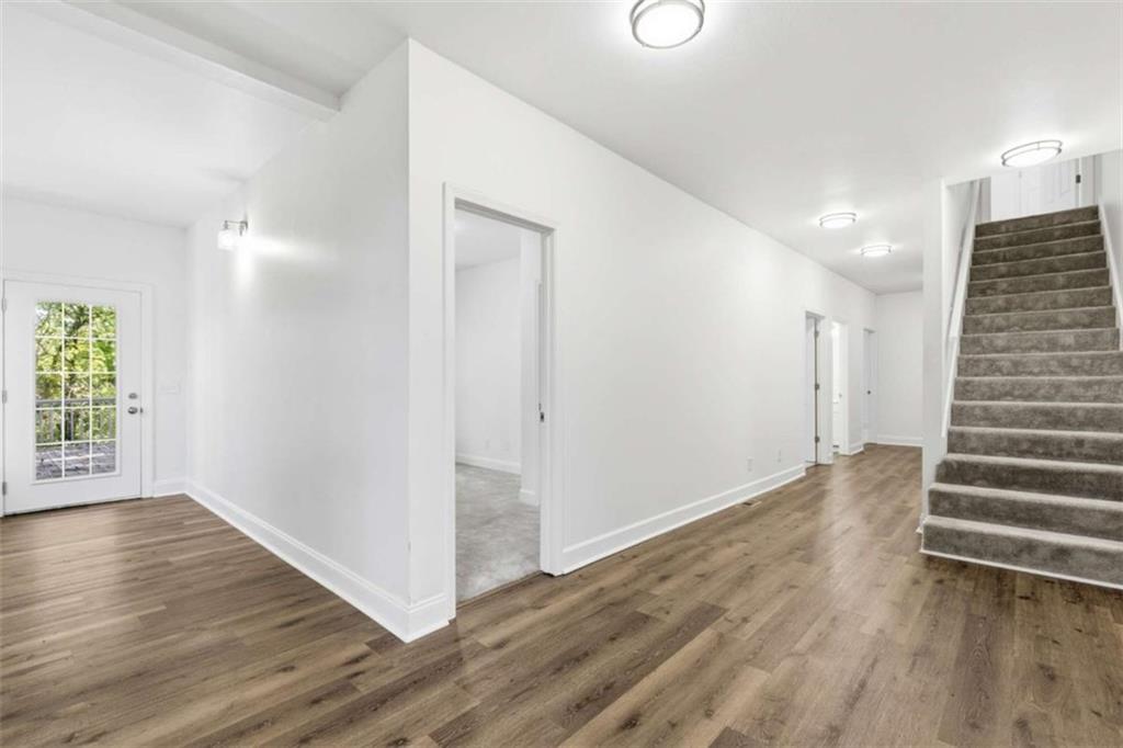 622 Spring Crest Road Cleveland, GA 30528 - Photo 28 of 48 a view of an empty room with wooden floor and a window