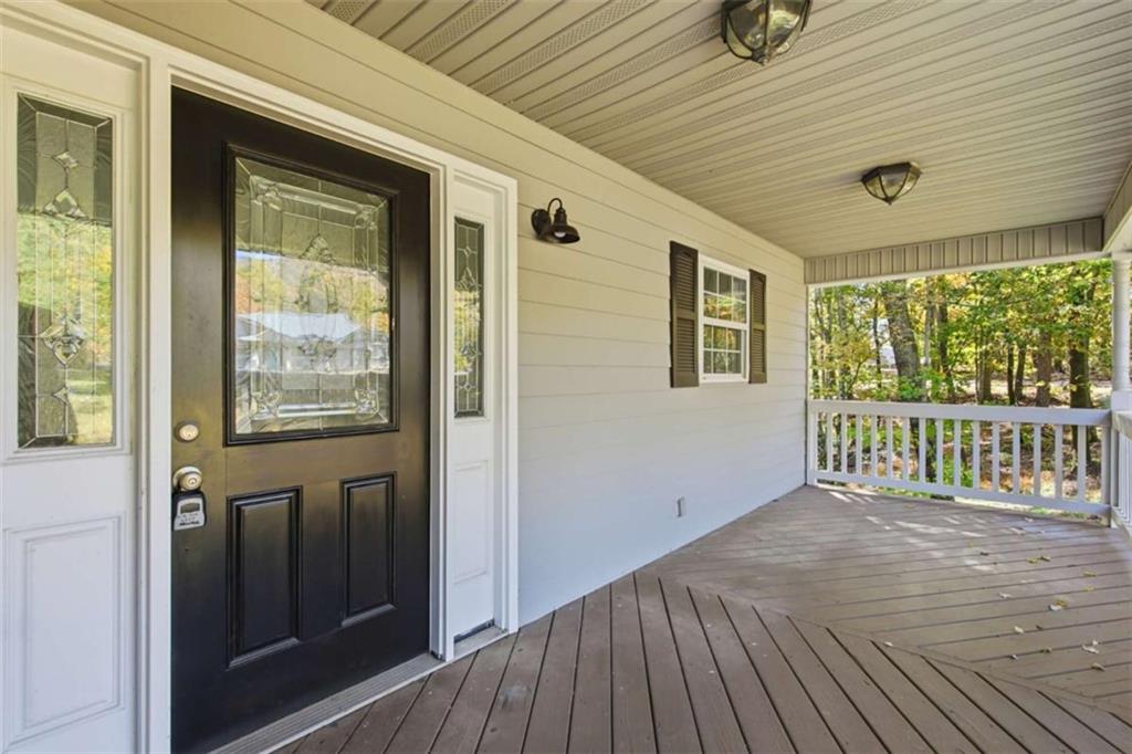 622 Spring Crest Road Cleveland, GA 30528 - Photo 3 of 48 a view of a porch with wooden floor and outdoor space