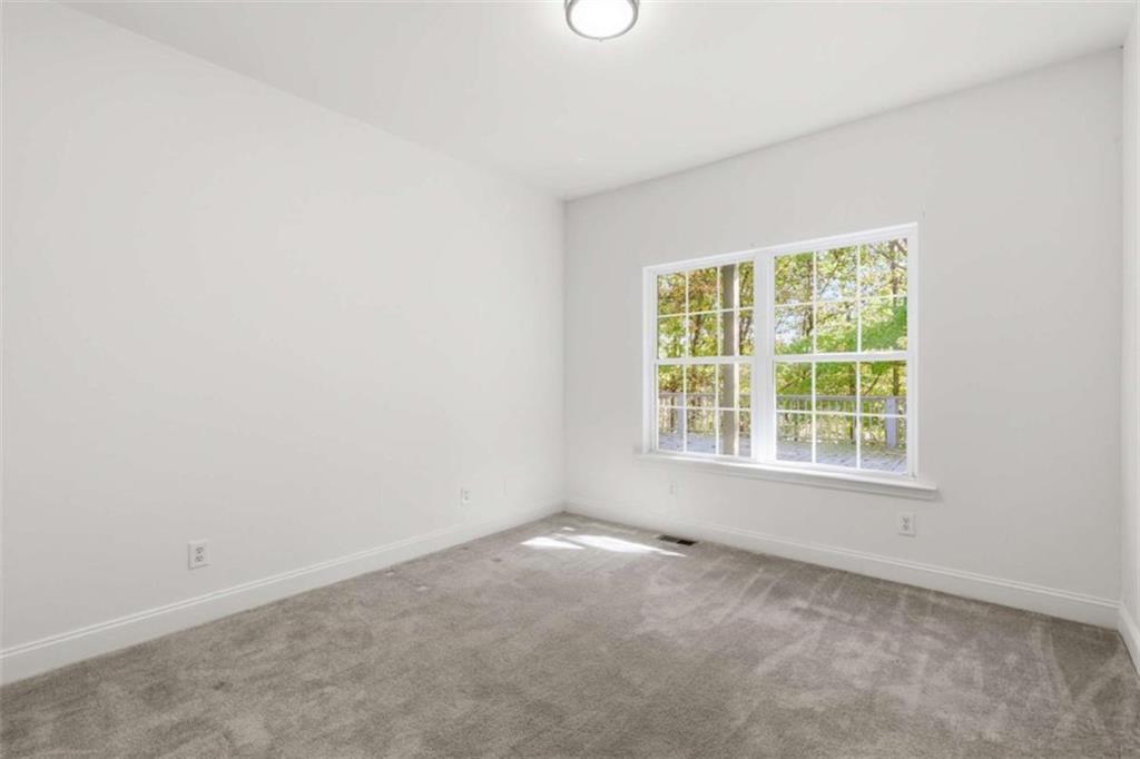 622 Spring Crest Road Cleveland, GA 30528 - Photo 33 of 48 an empty room with a window