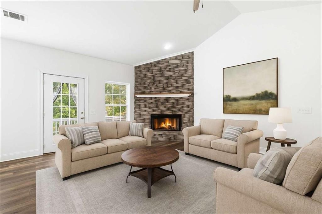 622 Spring Crest Road Cleveland, GA 30528 - Photo 7 of 48 a living room with furniture and a fireplace