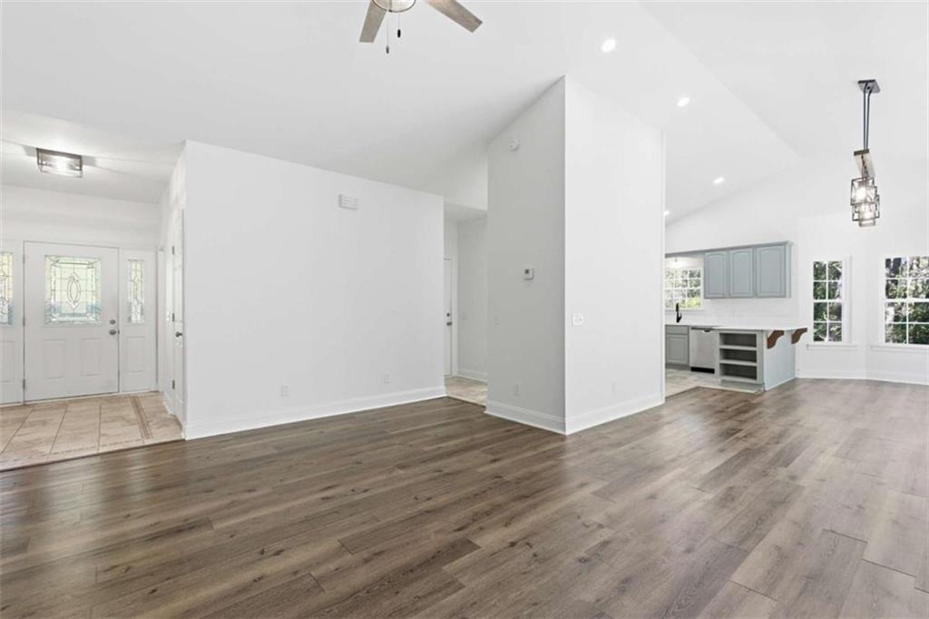 622 Spring Crest Road Cleveland, GA 30528 - Photo 9 of 48 an empty room with wooden floor and windows