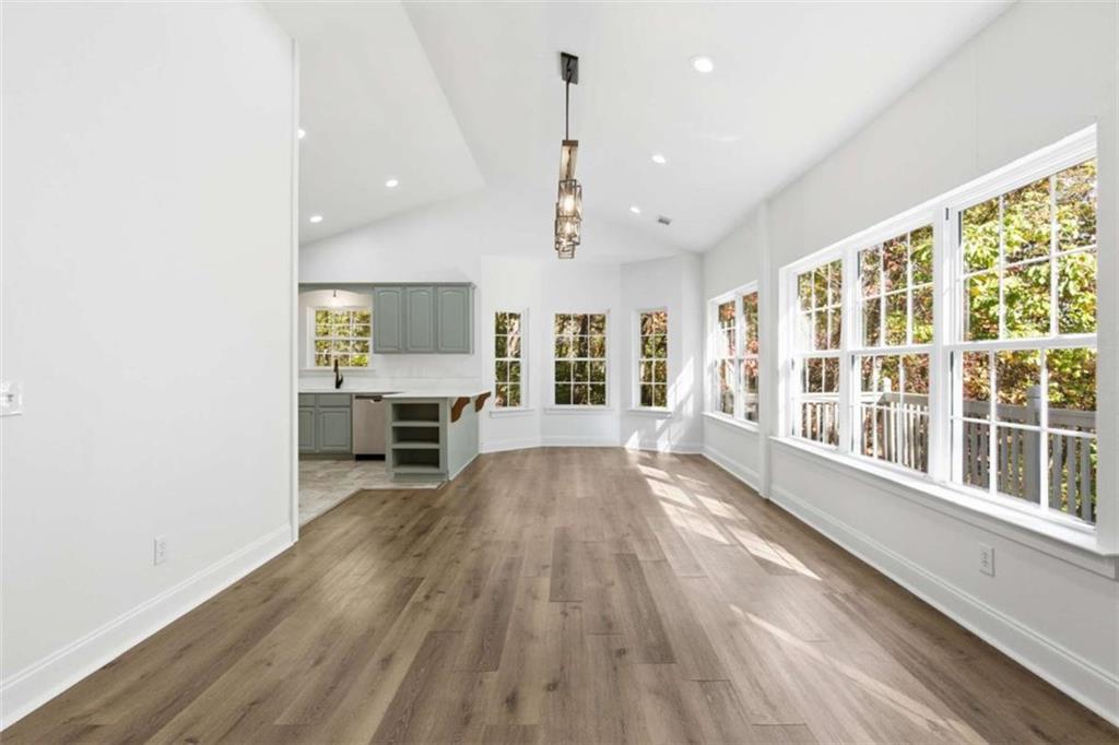 622 Spring Crest Road Cleveland, GA 30528 - Photo 10 of 48 a view of an empty room with wooden floor and a window