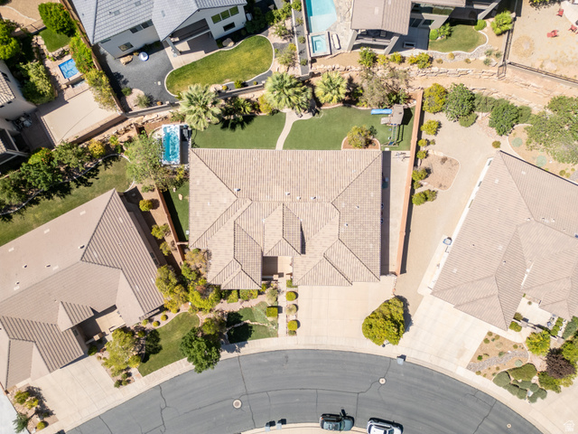 1257 West 2320 South St. George, UT 84770 - Photo 52 of 55 Residential property featuring a tile roof, a manicured lawn, and a private swimming pool