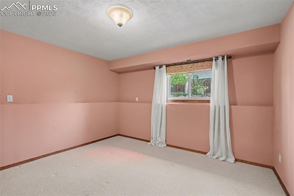 5301 Pinon Valley Road Colorado Springs, CO 80919 - Photo 21 of 27 an empty room with windows