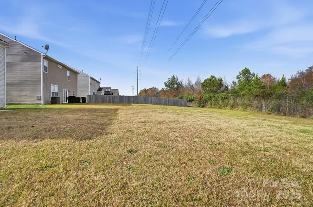 a view of a big yard with an outdoor space