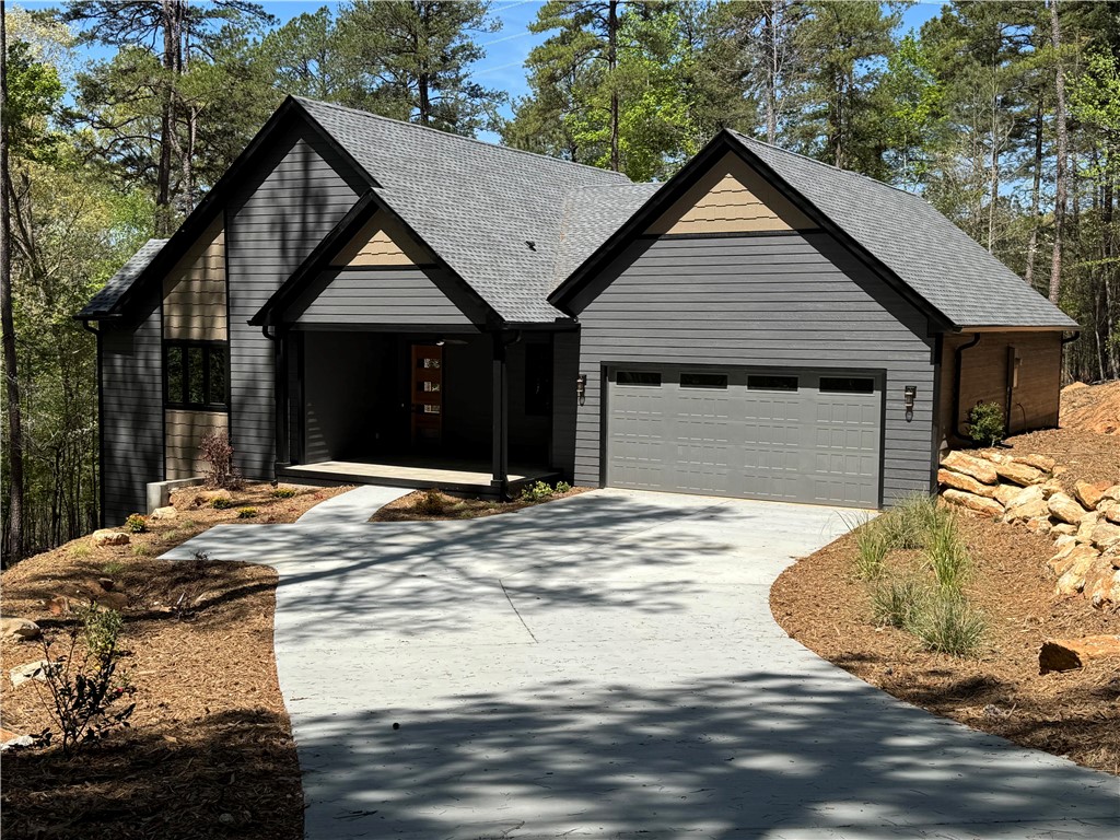 940 Coachmans Trail West Union, SC 29696 - Photo 40 of 41 This newly built home features a welcoming covered entrance and a well-maintained driveway.