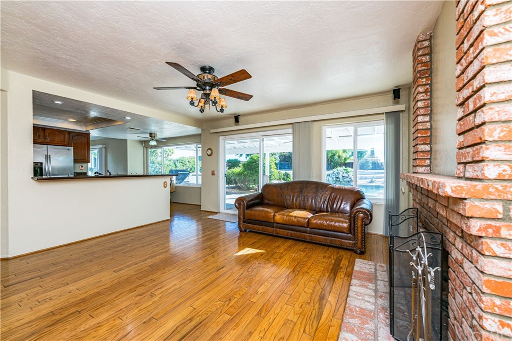 22041 Windtree Avenue Wildomar, CA 92595 - Photo 12 of 47 a living room with furniture and a large window