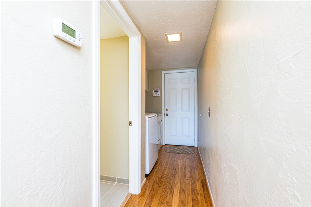 22041 Windtree Avenue Wildomar, CA 92595 - Photo 18 of 47 a view of a hallway with wooden floor