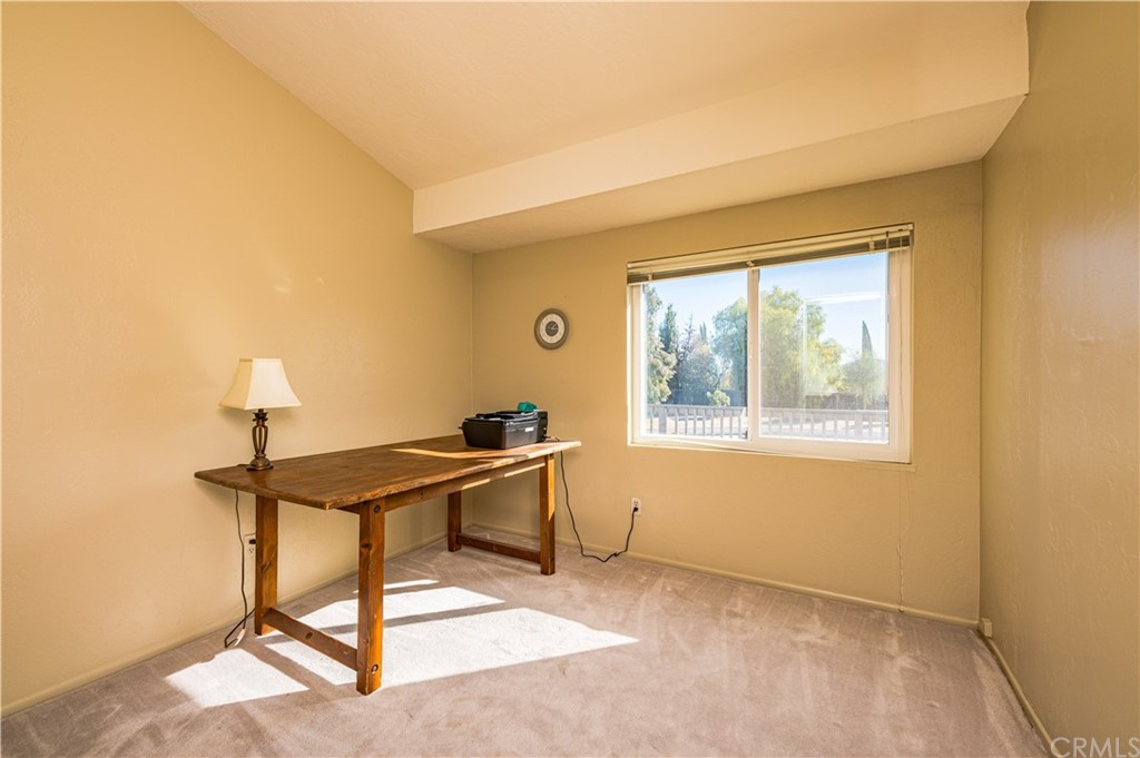 22041 Windtree Avenue Wildomar, CA 92595 - Photo 27 of 47 a view of a workspace with furniture and a window