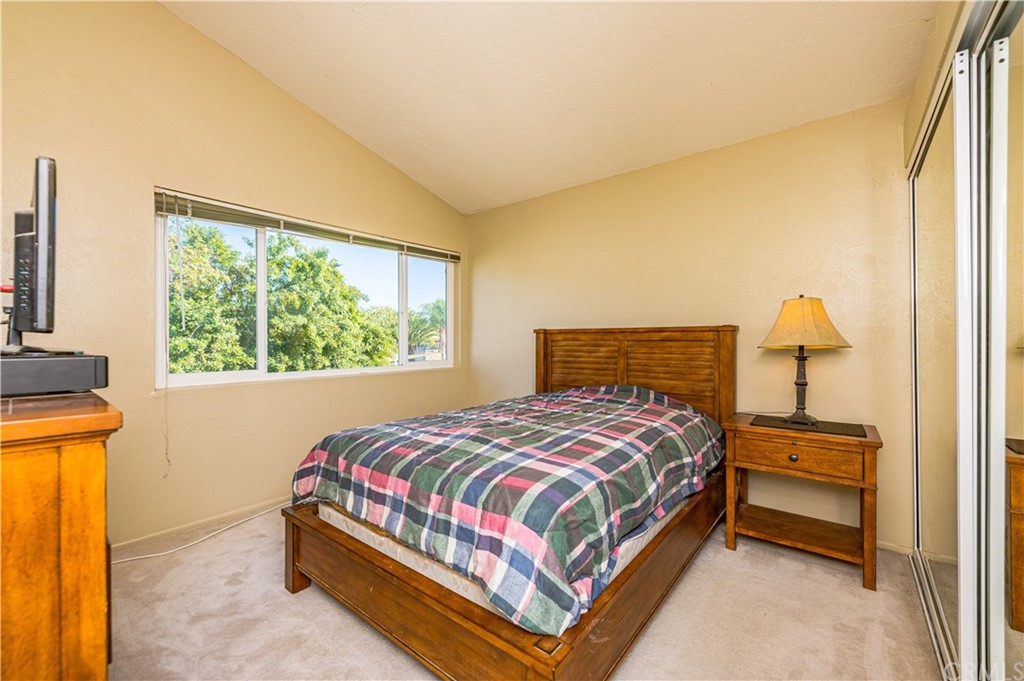 22041 Windtree Avenue Wildomar, CA 92595 - Photo 28 of 47 a bedroom with a bed and a window