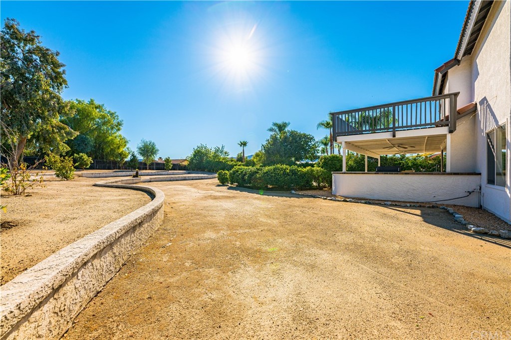 22041 Windtree Avenue Wildomar, CA 92595 - Photo 34 of 47 a view of swimming pool with outdoor seating and plants