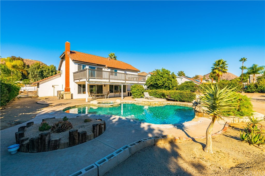 22041 Windtree Avenue Wildomar, CA 92595 - Photo 38 of 47 a front view of a house with garden
