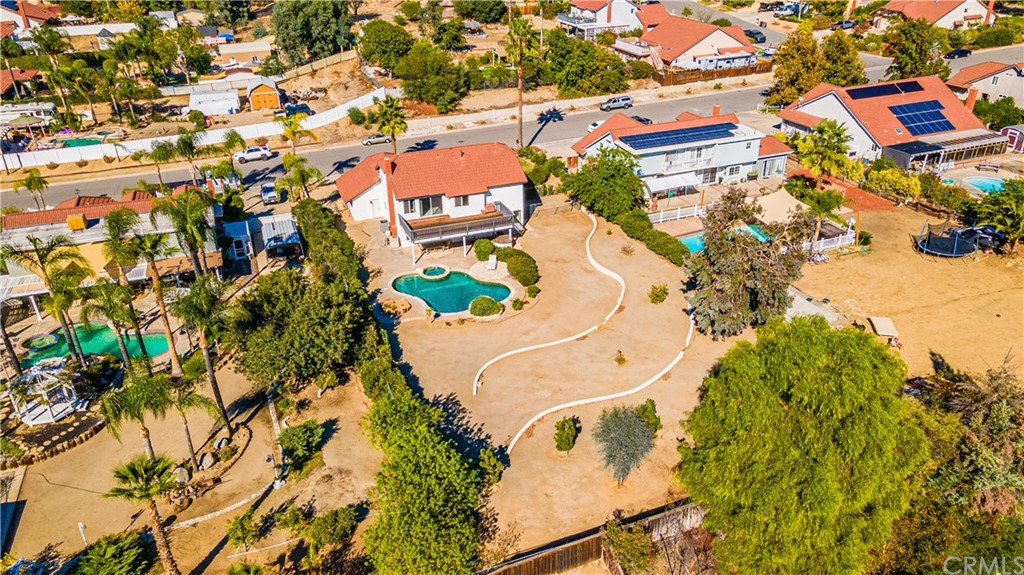 22041 Windtree Avenue Wildomar, CA 92595 - Photo 42 of 47 an aerial view of residential house with swimming pool and lawn chairs