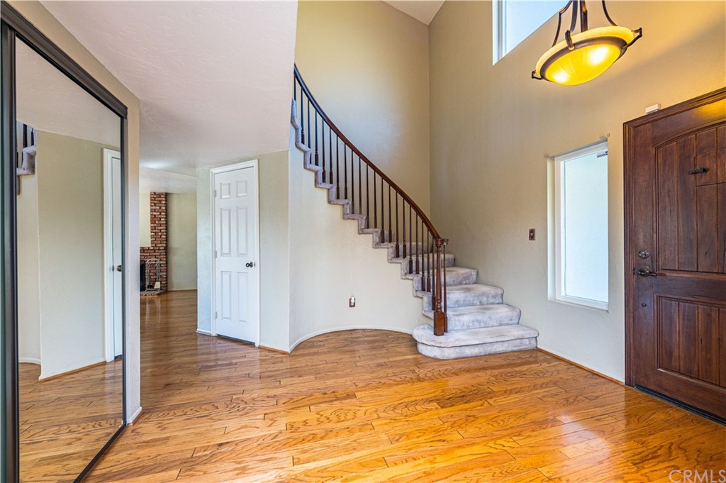 22041 Windtree Avenue Wildomar, CA 92595 - Photo 10 of 47 a view of a hallway view with wooden floor and staircase