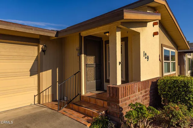 a front view of a house with a garage