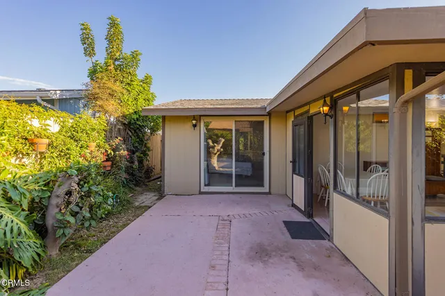 a view of a back yard with an outdoor space